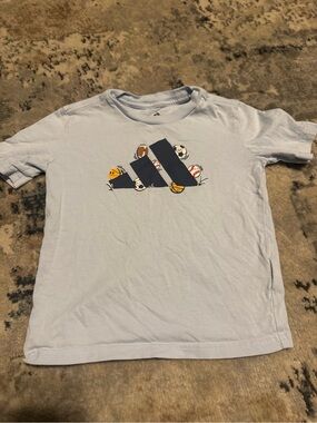 adidas Light Blue Tee with Navy Logo and Sports Graphics